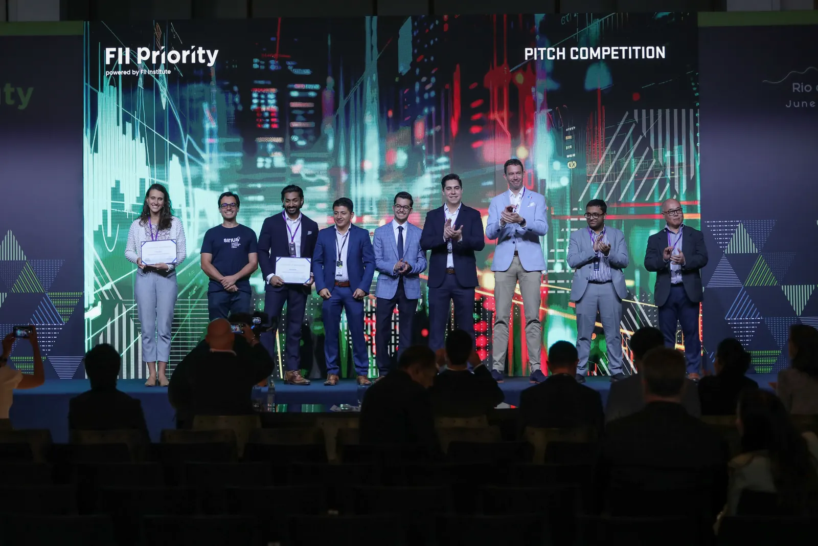 Finalists of the FII PRIORITY Rio de Janeiro pitch competition on stage.